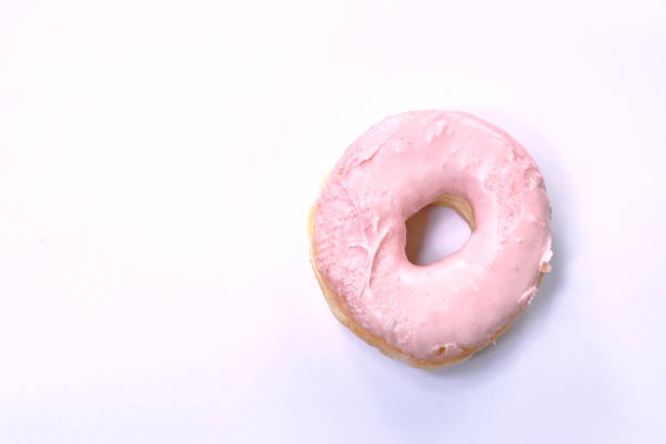 istock strawberry cream donuts on white background 1167031587