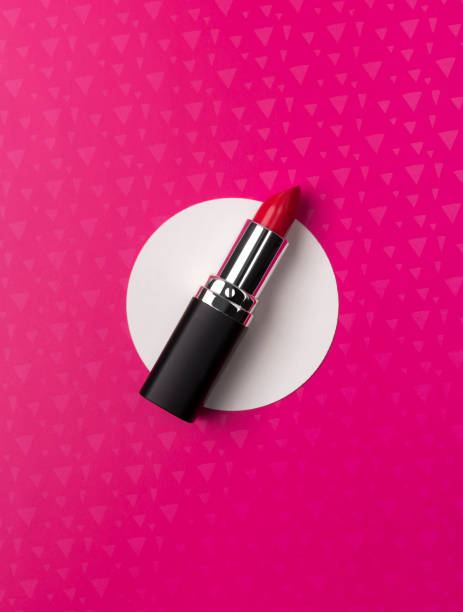 istock Bright red lipstick on creative neon pink background 1167033079
