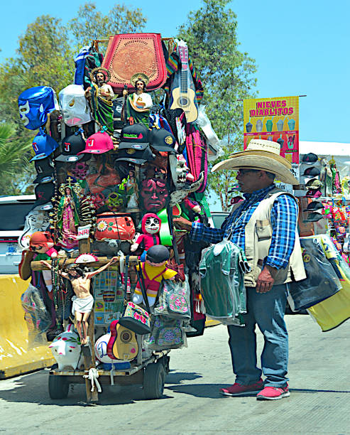 Mexican vendor's cart filled with goods for sale, from toys and hats to aztec calendars and religious items