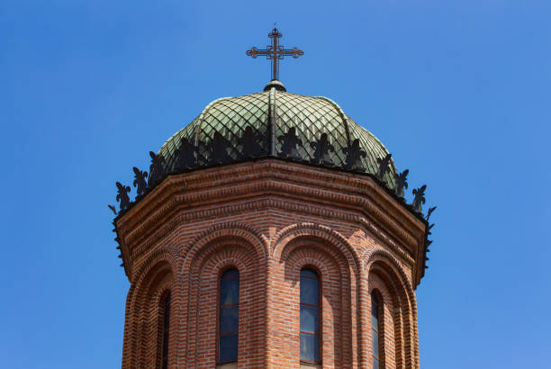Bucharest, Romania - July 11, 2019: The cupola with cross of the front tower of the church of the Antim Monastery built between 1713 and 1715 by Saint Antim Ivireanul in Bucharest. Editorial use only