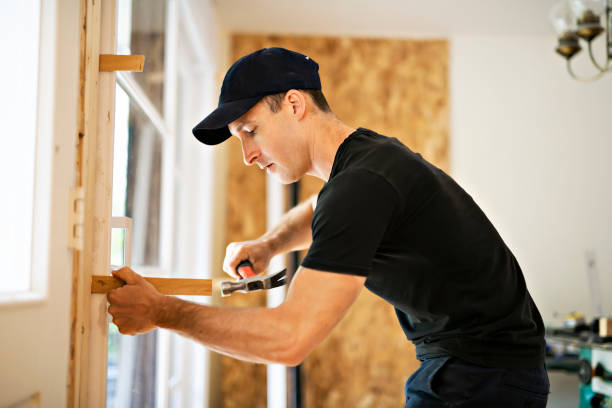 istock A handsome young man installing Double Sliding Patio Door in a new house construction site 1167036654