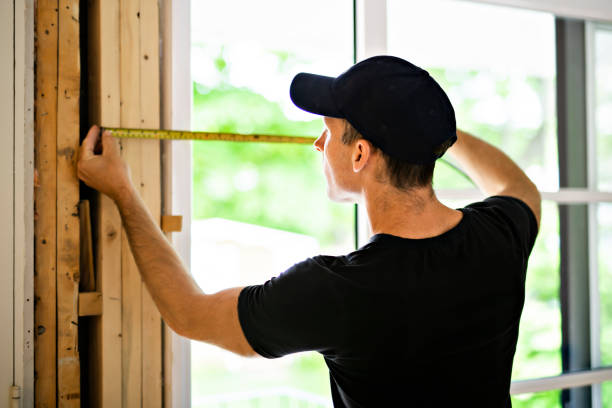 istock A handsome young man installing Double Sliding Patio Door in a new house construction site 1167036657