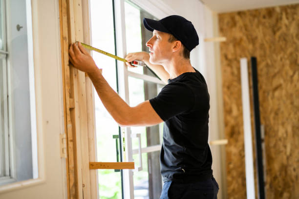 istock A handsome young man installing Double Sliding Patio Door in a new house construction site 1167036722