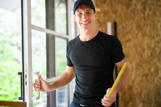 istock A handsome young man installing Double Sliding Patio Door in a new house construction site 1167036733