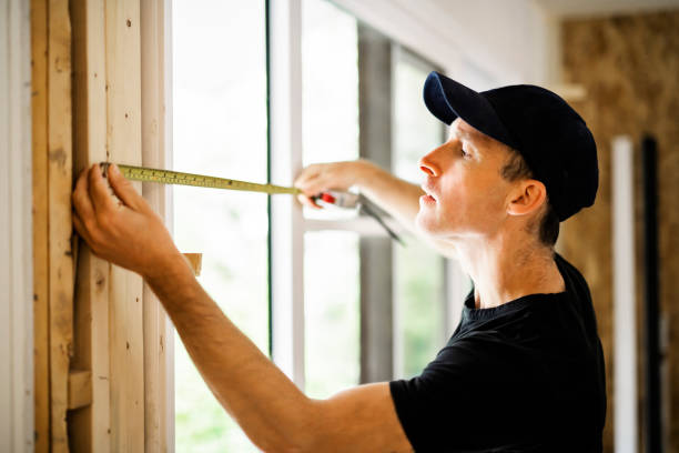 istock A handsome young man installing Double Sliding Patio Door in a new house construction site 1167036745