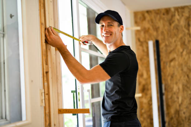 istock A handsome young man installing Double Sliding Patio Door in a new house construction site 1167036747