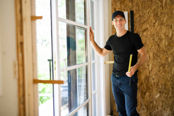 istock A handsome young man installing Double Sliding Patio Door in a new house construction site 1167036845