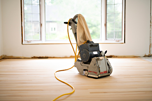 A Sanding hardwood floor with the grinding machine only tool