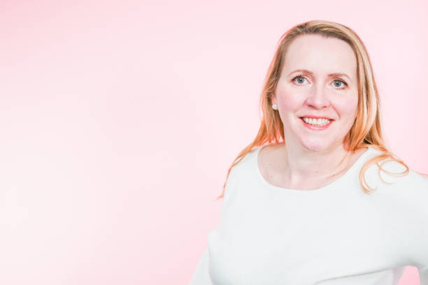 istock Studio portrait of smiling middle aged woman. 1167038191