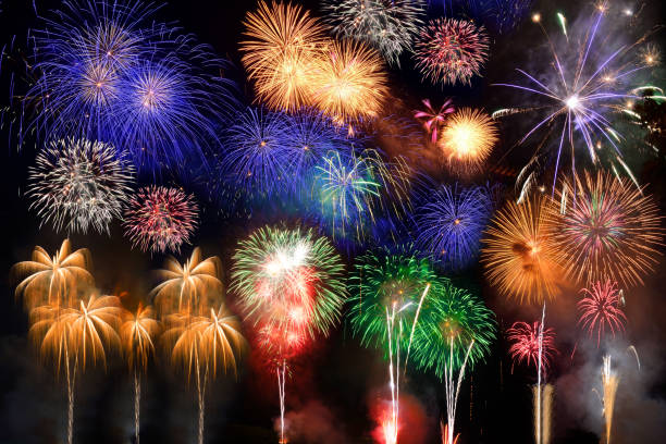 istock Colorful fireworks. Fireworks are a class of explosive pyrotechnic devices used for aesthetic and entertainment purposes. Visible noise due to low light, soft focus, shallow DOF, slight motion blur 1167039534