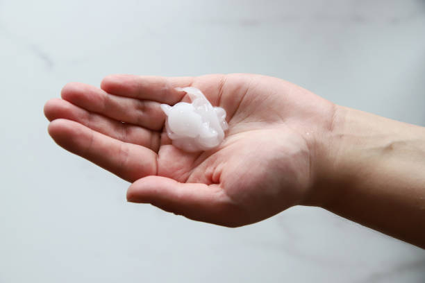 istock White gel in female hands 1167040720