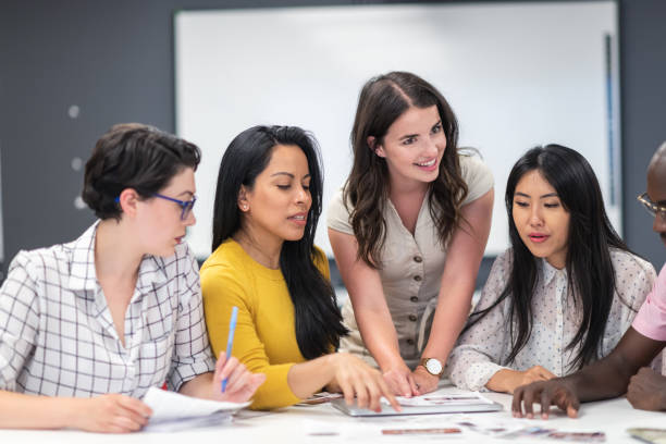 istock Successful female leader meeting with colleagues 1167040888