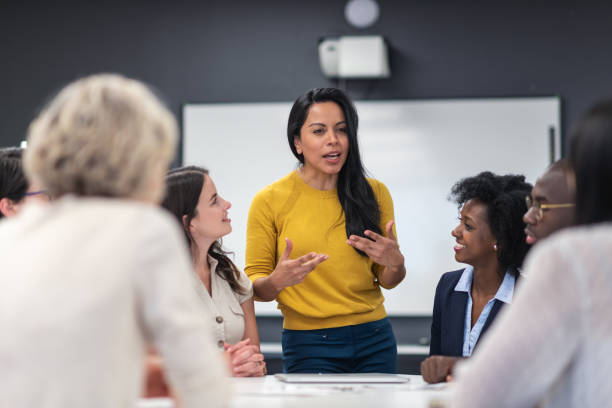 istock Successful female leader meeting with colleagues 1167040903
