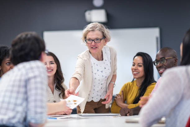 istock Female analyst presenting to business board members 1167041133