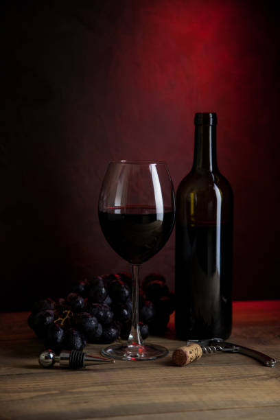 istock Glass of red wine on the table 1167043530