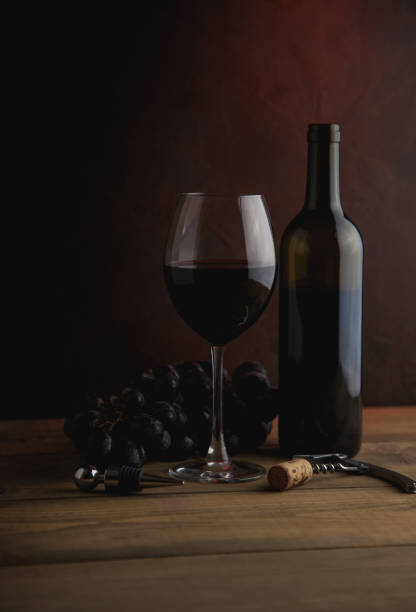 istock Glass of red wine on the table 1167043537