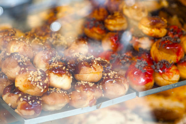 Portuguese cream puffs in the show case of a bakery in Porto, Portugal.
