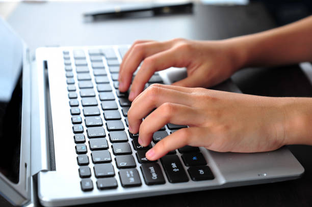 istock Close-up of typing female hands on keyboard 1167044507