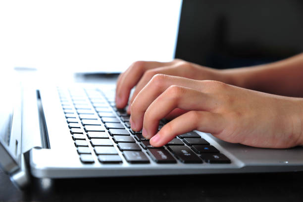 istock Close-up of typing female hands on keyboard 1167044508