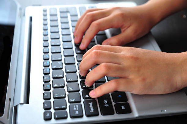 istock Close-up of typing female hands on keyboard 1167044512
