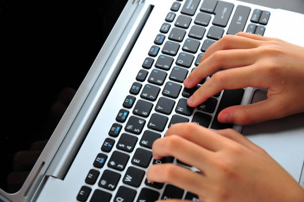 istock Close-up of typing female hands on keyboard 1167044517