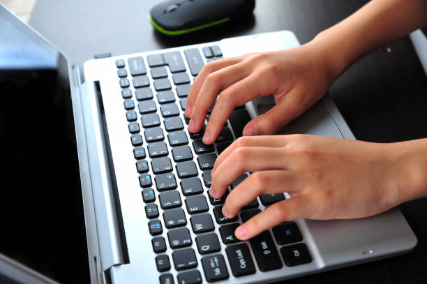 istock Close-up of typing female hands on keyboard 1167044523