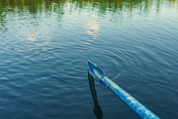 istock old blue oar in water waves backgrounds 1167044744
