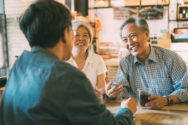 istock Family sitting in cafe and talking 1167046173