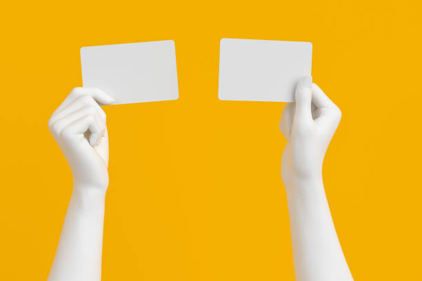 hand holding credit card or business card.