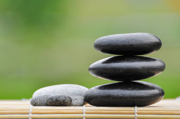 istock Pebble stones on nature bokeh background - SPA Concept 1167048519