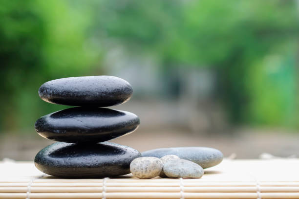 istock Pebble stones on nature bokeh background - SPA Concept 1167048568