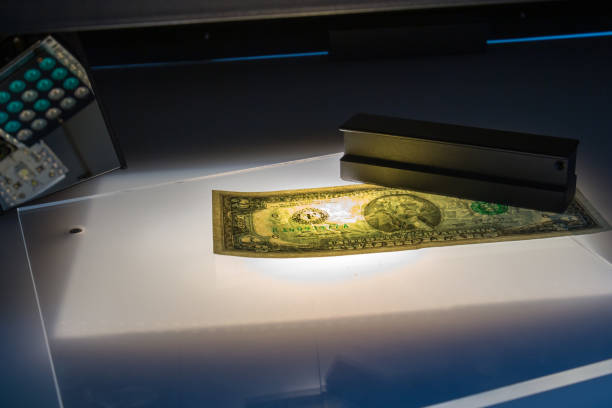istock Verifying the authenticity of the dollars 1167048897
