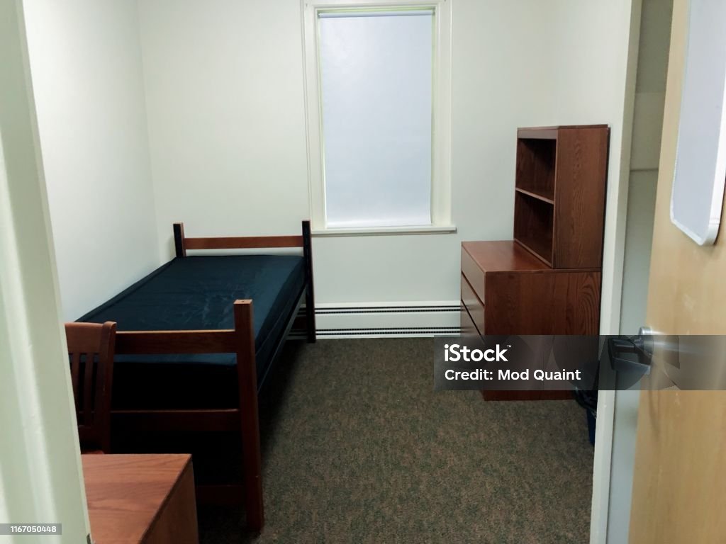 Basic Nondescript Undecorated White Box Dorm Room Standard college/university/boarding student dormitory room. College Dorm Stock Photo