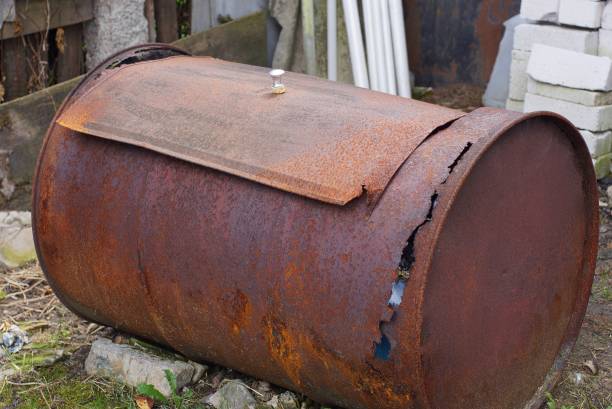 istock big rusty old and dirty barrel lies on the ground 1167051434