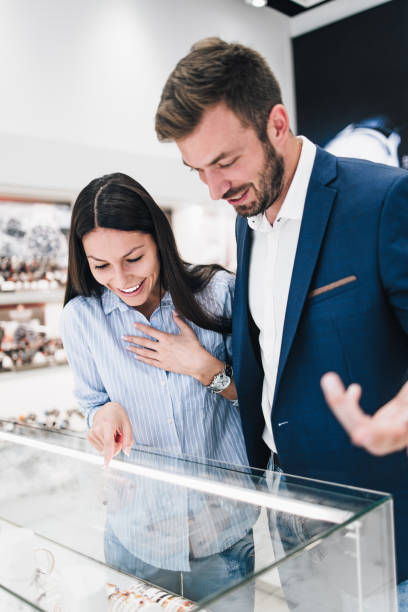 istock Middle age couple in jewelry store 1167055407