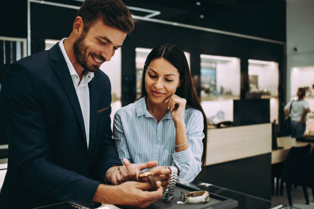 istock Middle age couple in jewelry store 1167055694