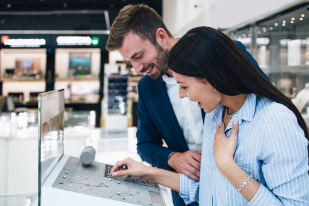 istock Attractive middle age couple in jewelry store 1167055698