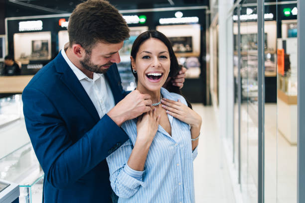 istock Attractive middle age couple in jewelry store 1167055701