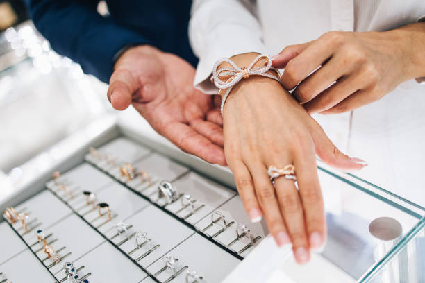 istock Attractive middle age couple at jewelry store 1167055948