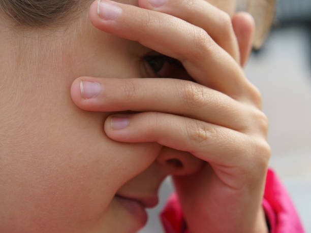 istock The girl plays hide and seek. 1167057630