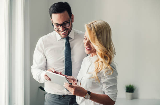 istock Business couple with digital tablet in the office 1167059930