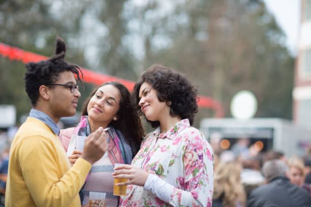 istock Festival : friends having a drink together and smoking a cigaret 1167060044