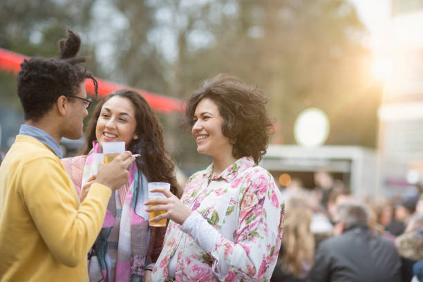 istock Festival : friends having a drink together and smoking a cigaret 1167060047