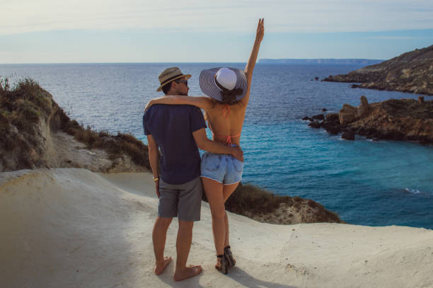 istock Couple embrace in the day on the seaside 1167063656