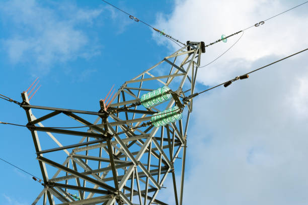 istock a high voltage power pylons against blue sky 1167068489