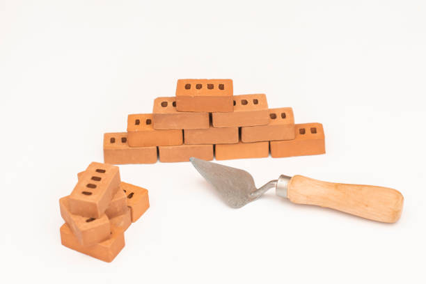 istock Construction of small brick blocks, toy for child development on white background. 1167073858