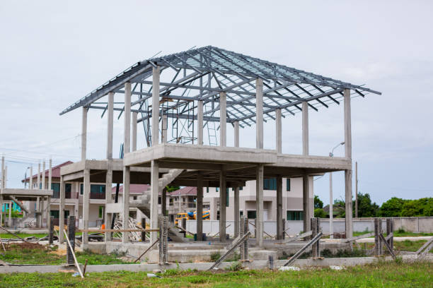 istock Home under construction using steel frames against. New residential construction home metal framing against. 1167074178