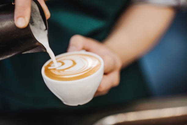 istock Coffee Barista making a cappuccino coffee cream with hot milk 1167075261