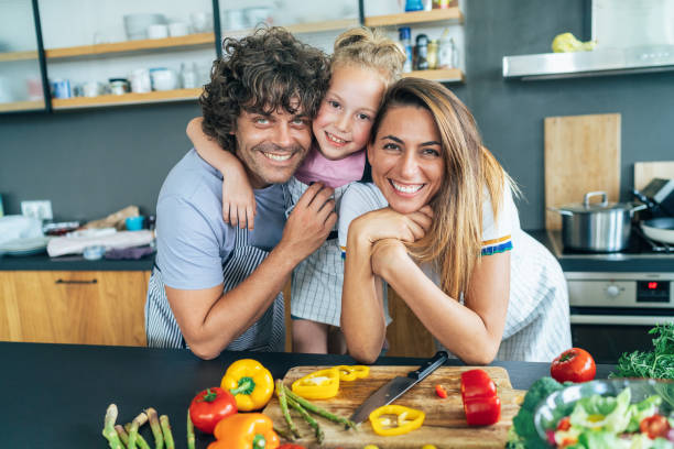 istock Happy family in the kitchen 1167076640