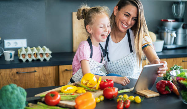 istock Mother and daughter in the kitchen 1167076643